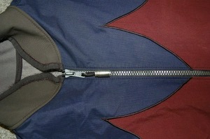A close-up of the stitching and Doom's signature bullet shell.  Photo by Bicycle Paper