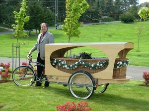 Wade Lind of Sunset Hills Cemetery and Funeral Home in Eugene, Ore., displays his one-of-a-kind rickshaw hearse.  Photo courtesy of Sunset Hills Cemetery and Funeral Home 