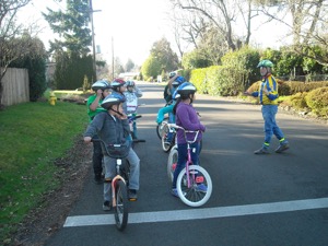 Hal Ballard teaching a group of children the rules of the road. Photo courtesy of All About Bikes 