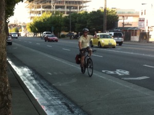 One of the ways to signal a right turn.  Photo by Bicycle Paper