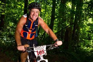 The NW Epic Series brought marathon mountain bike racing to Capitol Forest on August 27. Participants of all ages and abilities challenged themselves while discovering new trails. This is KC Butler, a retired prison guard and the oldest rider in 2011. He also volunteered 25 hours, weed whacking the trails to make them what they were. Photo by Steve Sanders