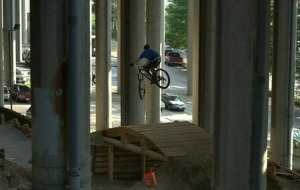 Airing it out under the bridge, one of the many obstacles at Colonnade. Photo by Dennis  Bennett